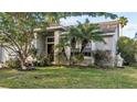 Single-story home with nicely landscaped front yard at 4931 Ridgemoor Cir, Palm Harbor, FL 34685