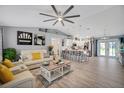 Open concept living and kitchen area with modern finishes at 12476 Jaybird Rd, Weeki Wachee, FL 34614
