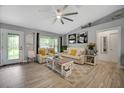Spacious living room with vaulted ceilings, and comfy furniture at 12476 Jaybird Rd, Weeki Wachee, FL 34614