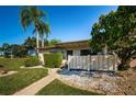 Front view of single story condo with fenced patio at 180 Ingrid Pl, Oldsmar, FL 34677