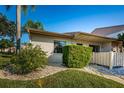 Side view of single story condo with small patio area at 180 Ingrid Pl, Oldsmar, FL 34677