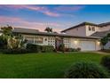 Mid-century modern home with landscaped yard at 429 3Rd N Ave, Tierra Verde, FL 33715