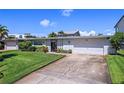 Mid-century modern home with driveway at 429 3Rd N Ave, Tierra Verde, FL 33715