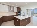 Modern kitchen with stainless steel appliances and an island at 301 1St Street South # 2304, St Petersburg, FL 33701
