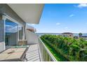 Spacious balcony with water views and seating for two at 1351 Gulf Blvd # 219, Clearwater, FL 33767