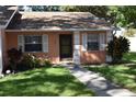 Charming one-story house with a peach exterior and lush landscaping at 2250 Druid E Rd # 605, Clearwater, FL 33764