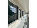 Condo hallway with exterior doors to each unit at 2362 Jamaican St # 64, Clearwater, FL 33763