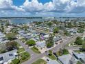 Aerial view of a single-story home with a spacious yard, located in a waterfront community at 16003 2Nd E St, Redington Beach, FL 33708