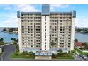 High-rise building with waterfront views and balconies at 9415 Blind Pass Rd # 1103, St Pete Beach, FL 33706