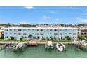 Light blue waterfront building with private boat docks at 12405 3Rd E St # 304, Treasure Island, FL 33706