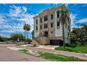 Three-story home with stone accents and a modern design at 3087 Cherry Ln, Clearwater, FL 33759