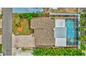 Aerial view showing home, pool, and surrounding landscape at 16110 3Rd E St, Redington Beach, FL 33708