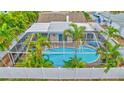 An aerial view of a refreshing pool with lush landscaping at 16110 3Rd E St, Redington Beach, FL 33708