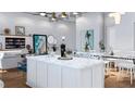 Modern kitchen with island, open to living and dining areas at 11605 1St E St # 6, Treasure Island, FL 33706