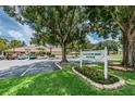 Village on the Green Condo II clubhouse and parking area at 2525 Royal Pines Cir # 26-A, Clearwater, FL 33763