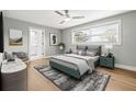 Comfortable bedroom with large window, neutral colors, and ensuite bathroom access for a peaceful retreat at 170 98Th N Ave, St Petersburg, FL 33702