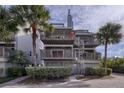 Two-story beach condo building with spiral staircases at 19930 Gulf Blvd # 1A, Indian Shores, FL 33785