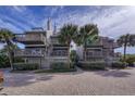 Two-story beach condo building with spiral staircases at 19930 Gulf Blvd # 1A, Indian Shores, FL 33785