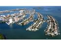 Wide aerial showcasing community and surrounding waterways at 105 Island Way # 121, Clearwater Beach, FL 33767