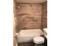 Clean bathroom with updated tile shower/tub combo at 4242 Redcliff Pl # 4242, New Port Richey, FL 34652