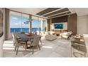Bright living room with water views and modern furniture at 5701 Bowen Daniel Dr. # 1701, Tampa, FL 33616