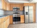 Modern kitchen featuring stainless steel appliances and light wood cabinetry at 5130 Brittany S Dr # 408, St Petersburg, FL 33715