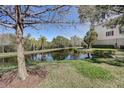 Peaceful pond scene with tree and building view at 3503 10Th W Ln, Palmetto, FL 34221