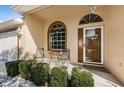 Inviting front porch with comfortable seating area at 4136 Rhone Dr, New Port Richey, FL 34655