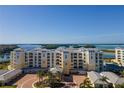 Luxury condo building with breathtaking views of the bay and lush surroundings at 755 Collany Rd # 401, Tierra Verde, FL 33715
