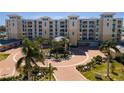 Luxury waterfront condos with circular driveway and tropical landscaping at 755 Collany Rd # 401, Tierra Verde, FL 33715