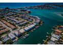 Wide aerial view of waterfront property and surrounding community at 12305 3Rd E St # 3, Treasure Island, FL 33706