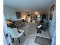 Bright living room with comfy seating and a fireplace at 2426 Persian Dr # 64, Clearwater, FL 33763