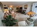 Spacious living room featuring ample seating and large windows at 2426 Persian Dr # 64, Clearwater, FL 33763