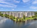 Spacious waterfront condo complex features lush landscaping and picturesque views of the surrounding waterway at 1200 Country Club Dr # 2106, Largo, FL 33771