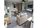 Spacious living room with light gray walls and stylish furniture at 7615 Marechal Ave, Port Richey, FL 34668