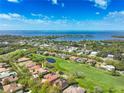 Luxury home with pool and spa, situated on a golf course with water views at 898 Skye Ln, Palm Harbor, FL 34683