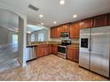 Modern kitchen with stainless steel appliances and granite countertops at 1806 Early Bird Pl, Ruskin, FL 33570