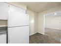 White kitchen appliances and granite countertop at 101 Lake Ne Ave # 225, Largo, FL 33771