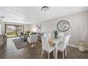 Bright dining area with white table and chairs at 101 Lake Ne Ave # 125, Largo, FL 33771