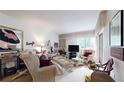 Living room with wicker furniture and decor at 2205 Belleair Rd # A13, Clearwater, FL 33764