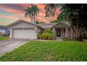 Single-Gathering home with attached garage and front porch at 1901 Ohio Ne Ave, St Petersburg, FL 33703
