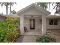 Covered front porch with seating and decorative landscaping at 1901 Ohio Ne Ave, St Petersburg, FL 33703