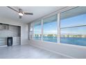 Living room with water views and built-in bar at 770 Island Way # N304, Clearwater, FL 33767