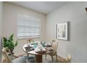 Bright dining area with a round table and four chairs, perfect for small meals at 12125 Spartan Way # 201, Hudson, FL 34667
