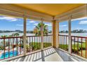 Spacious balcony overlooking the water and pool at 10301 Gulf Blvd # 402, Treasure Island, FL 33706