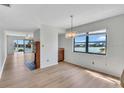 Bright dining room with water views and hardwood floors at 10301 Gulf Blvd # 402, Treasure Island, FL 33706