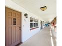 Condo building hallway with brown door at 650 Pinellas Point S Dr # 231, St Petersburg, FL 33705