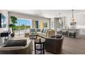 Open living space with water views and access to a balcony at 47A Bayview S Ct, St Petersburg, FL 33711