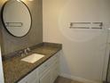 Updated bathroom with granite countertop at 940 Virginia St # 107, Dunedin, FL 34698