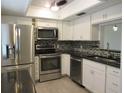 Modern kitchen with stainless steel appliances at 940 Virginia St # 107, Dunedin, FL 34698